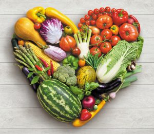 Heart shaped picture of a variety of vegetables